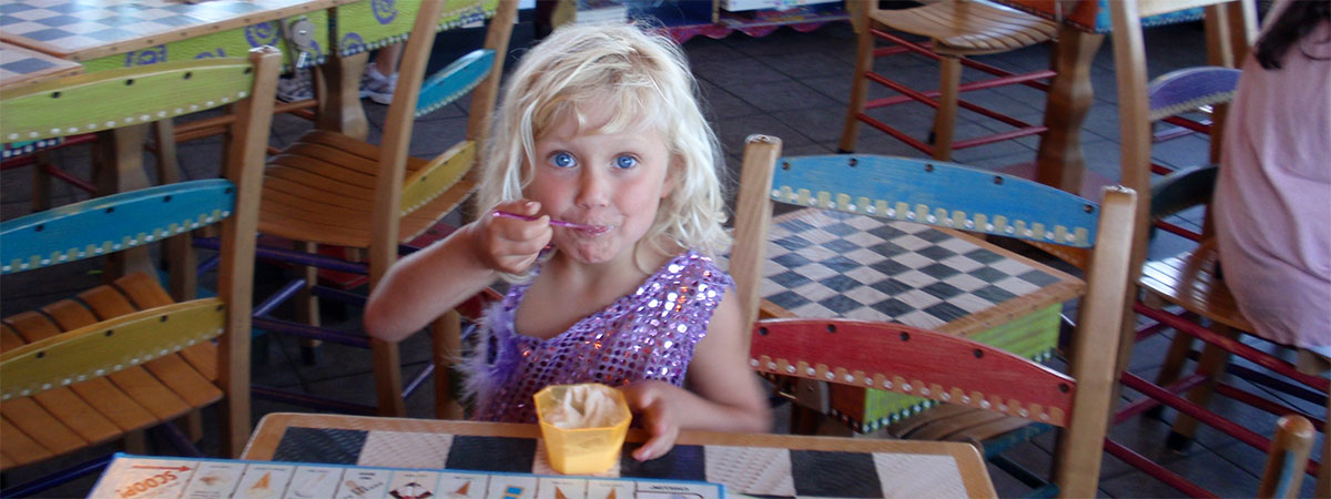 Blue eyed girl enjoying ice cream (slide)